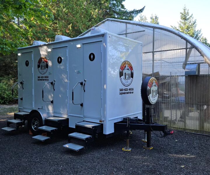 Cozy Cove Restroom Trailer Rental 4-door luxury bathroom trailer rentals for events near me. Location wedding in Port Townsend. Featuring The Four Seasons Restroom Trailer 4-stations