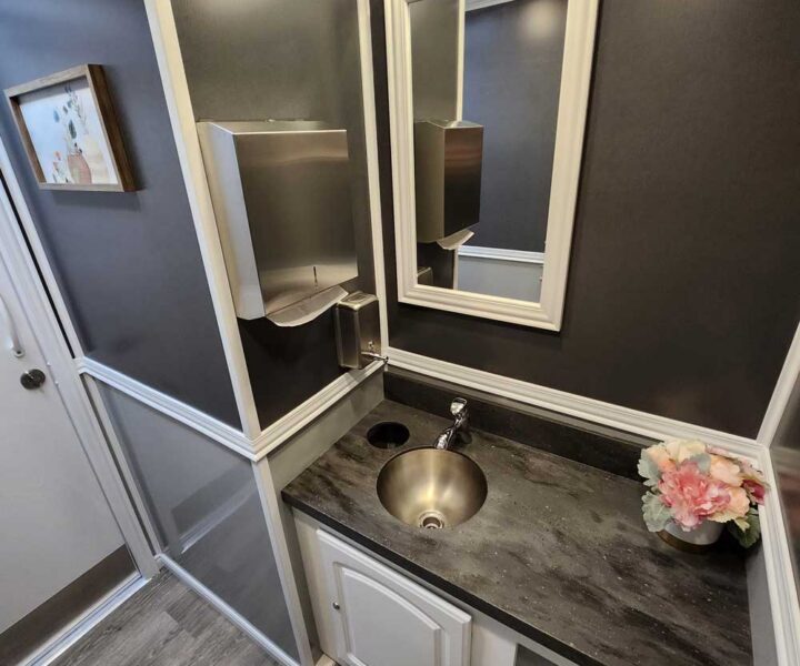 Cozy Cove Restroom Trailer Rentals 4-door luxury restroom rentals for events near me. The Four Seasons Restroom Trailer 4 stations.