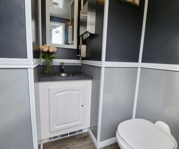 Cozy Cove Restroom Trailer Rentals 4-door luxury restroom rentals for events near me. The Four Seasons Restroom Trailer 4 stations. Interior photo