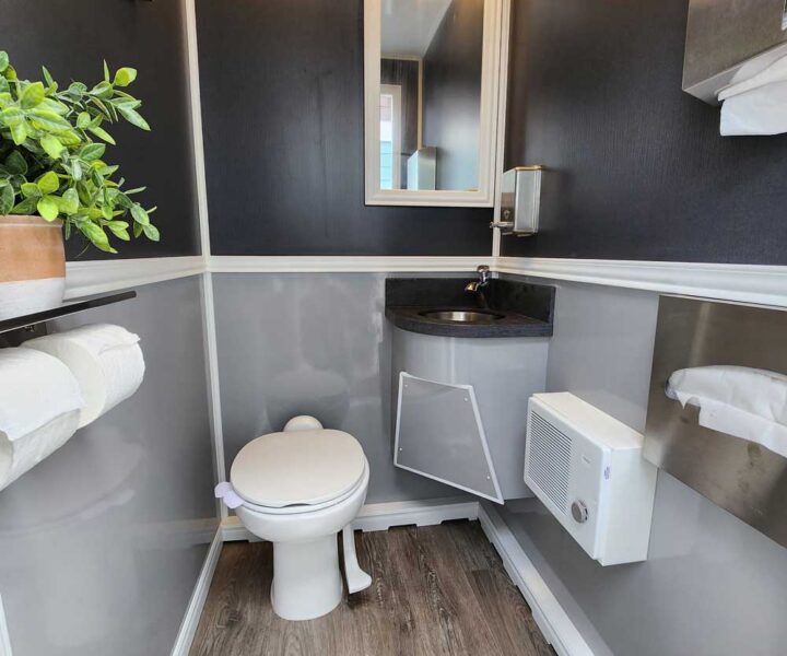 Cozy Cove Restroom Trailer Rentals 4-door luxury restroom rentals for events near me. The Four Seasons Restroom Trailer 4 stations. Interior photo